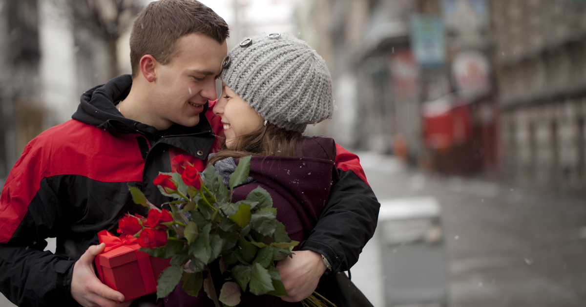 A man giving his partner a valentine's day gift