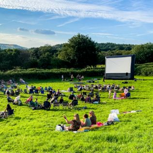 Family Outdoor or Drive In Cinema with Pizza Product Image