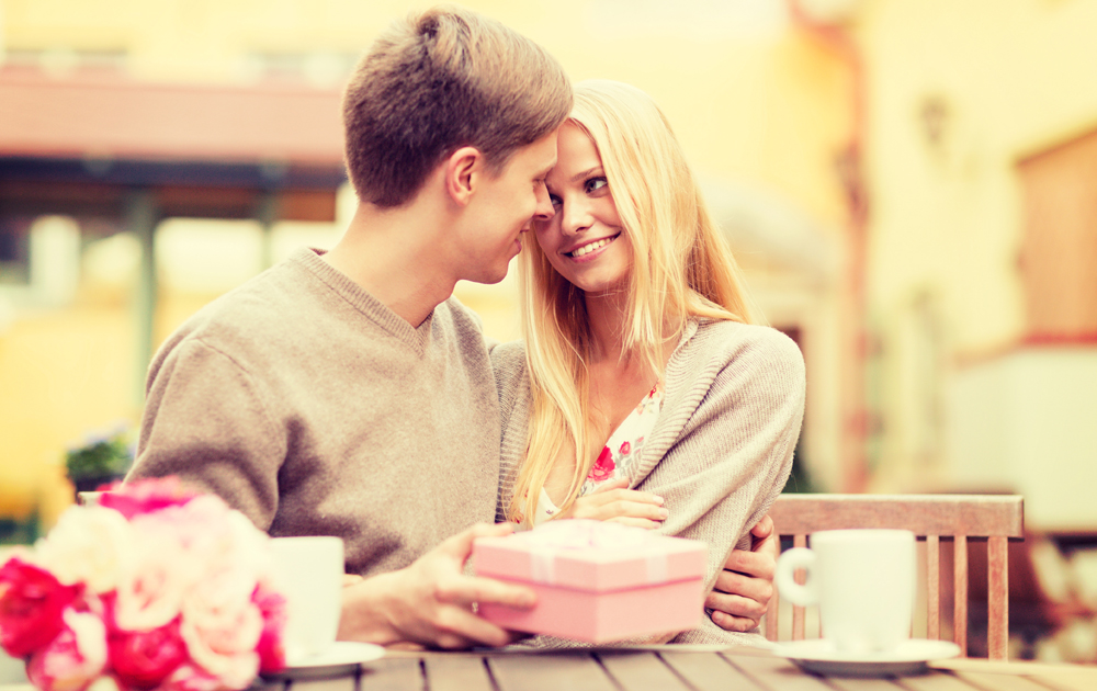 a man giving a woman a gift