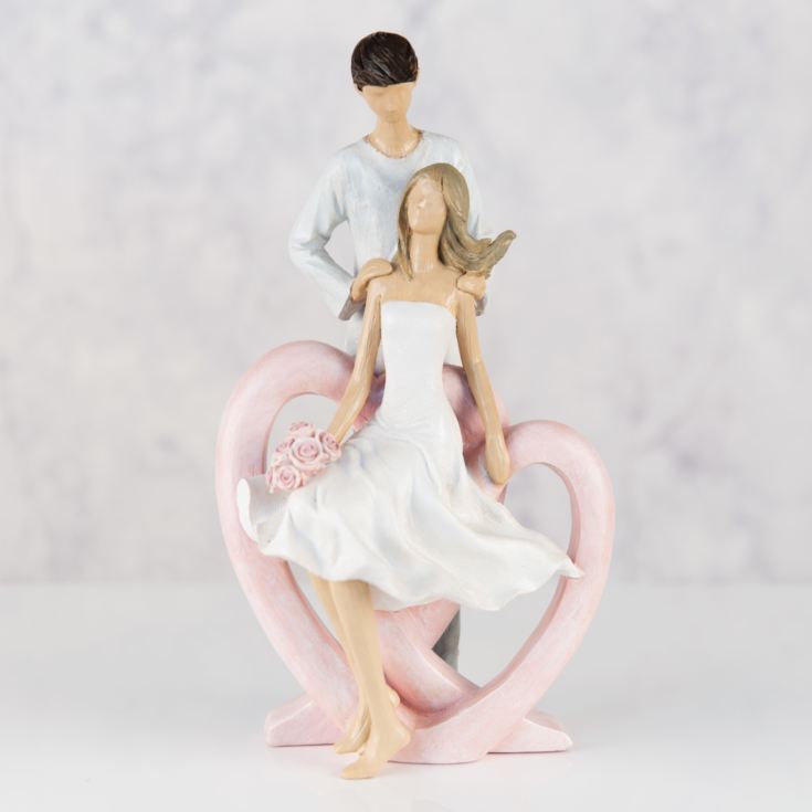 Resin Figurine - Man Holding Lady with Flowers product image