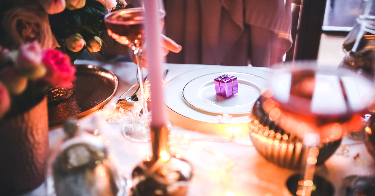 A gift on a plate at the rehearsal dinner