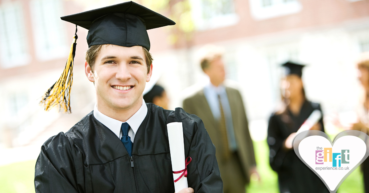 A happy graduate holding hi degree