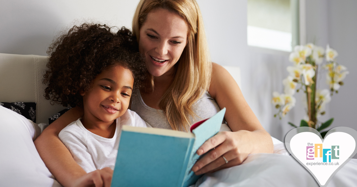 a mum readying a bedtime story to her daughter