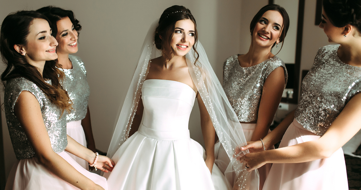 Bride getting ready for the wedding with her bridesmaids