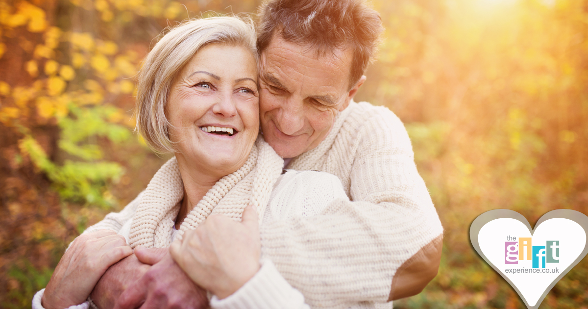 Man and woman hugging on a golden tinted background