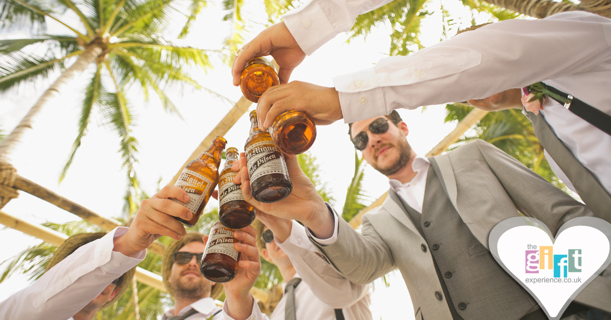 A stag group toasting with beers in an exotic location A stag group toasting with beers in an exotic location