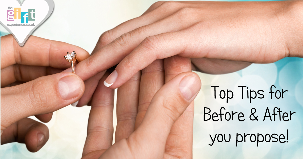 Hands putting on an engagement ring Hands putting on an engagement ring