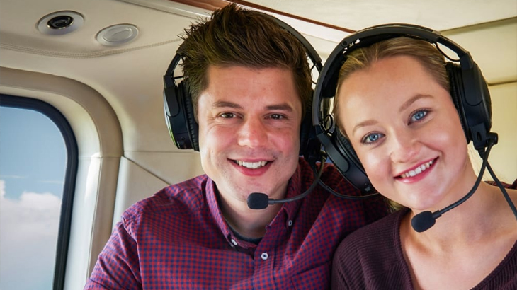 Couple enjoying a scenic helicopter ride together