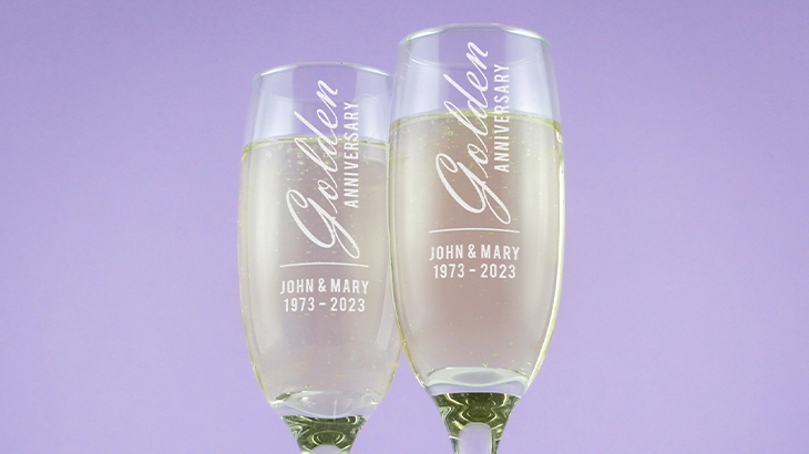 Pair of engraved golden anniversary champagne flutes, perfect for celebrating 50th wedding anniversaries and special milestones