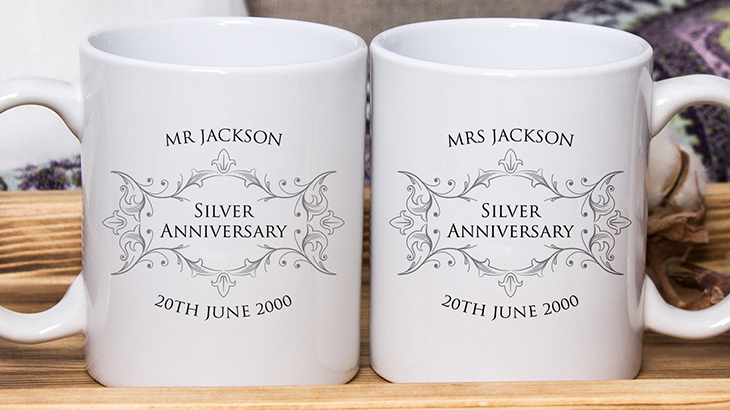 Pair of silver anniversary mugs personalised with couple’s names and wedding date, unique 25th wedding gift idea