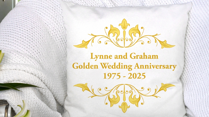 Personalised Golden Anniversary cushion on an armchair, customised with couple’s names and anniversary dates, 50th wedding gift