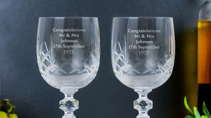 Personalised cut crystal wine glasses customised with five lines of personal messages, elegant anniversary or wedding gift