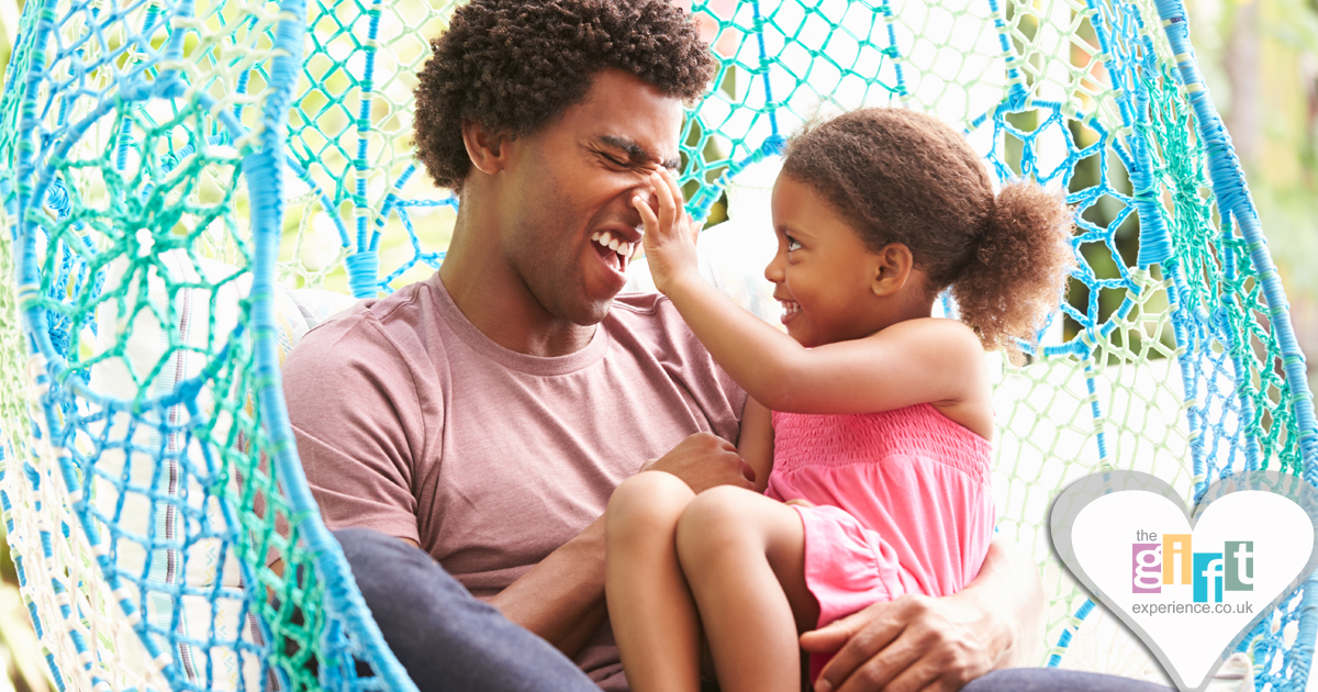 Little Girls plays with her dad's nose Little Girls plays with her dad's nose