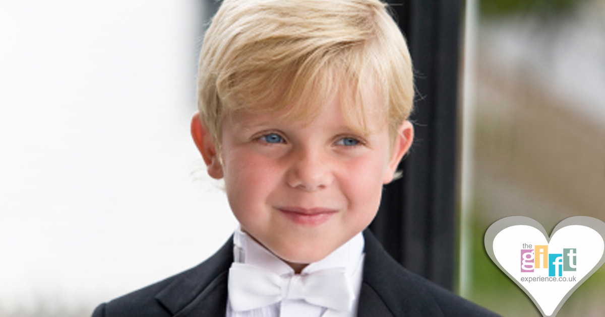 A page boy in his wedding suit