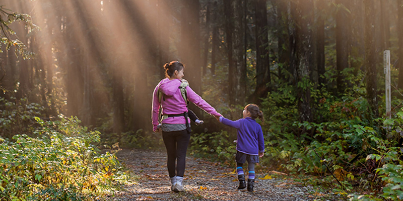 mum_and_girl_through_forest.jpg