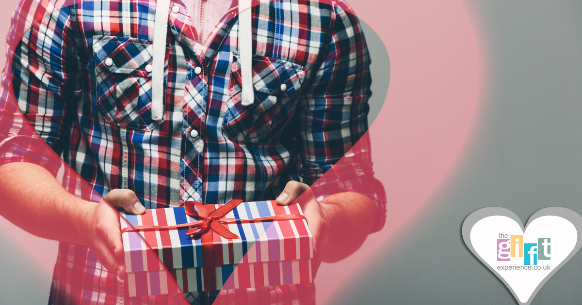 Man holding a Valentine's Day gift in a heart