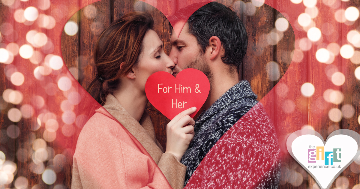 Couple kissing behind a red heart