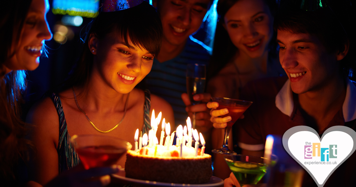 18 year old celebrating her birthday with cake and friends