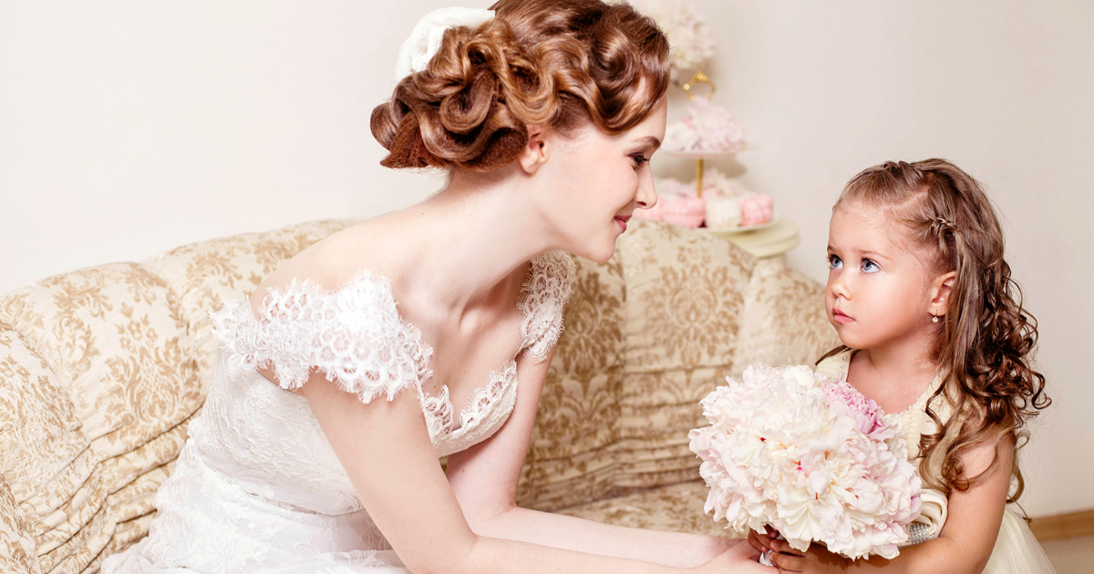 A bride and her very young bridesmaid