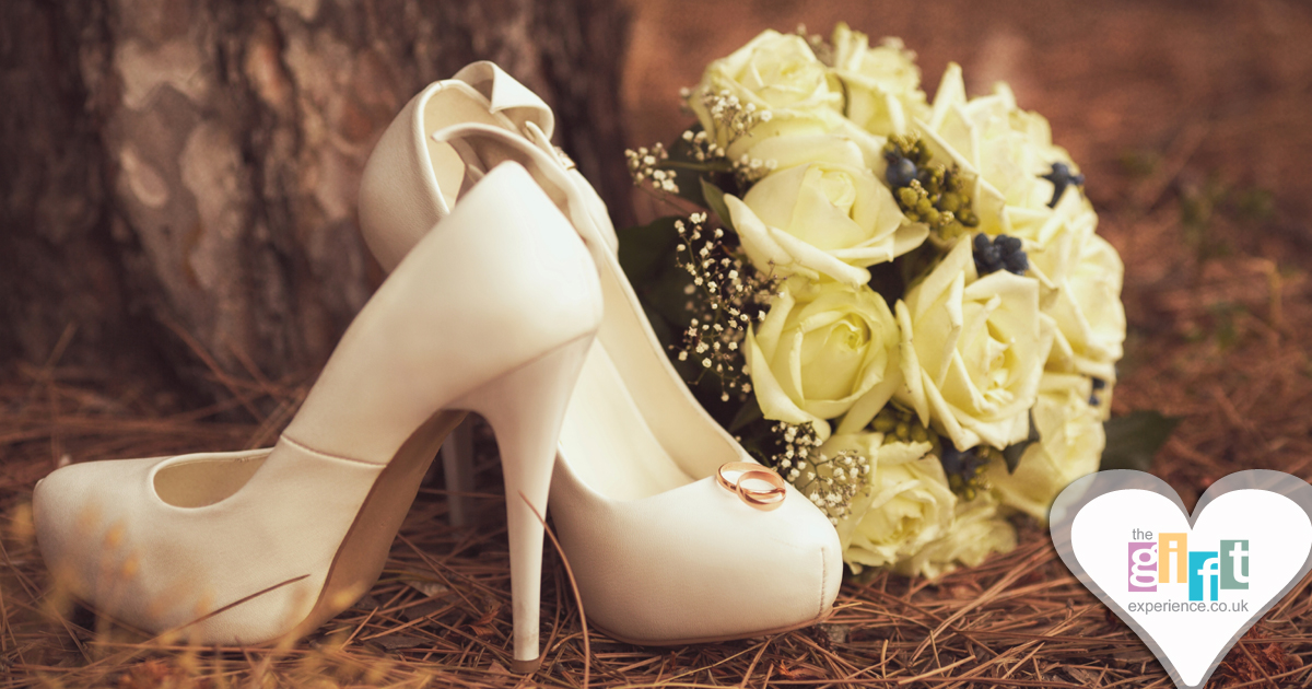 Ivory court shoes and a wedding bouquet in a wooded setting