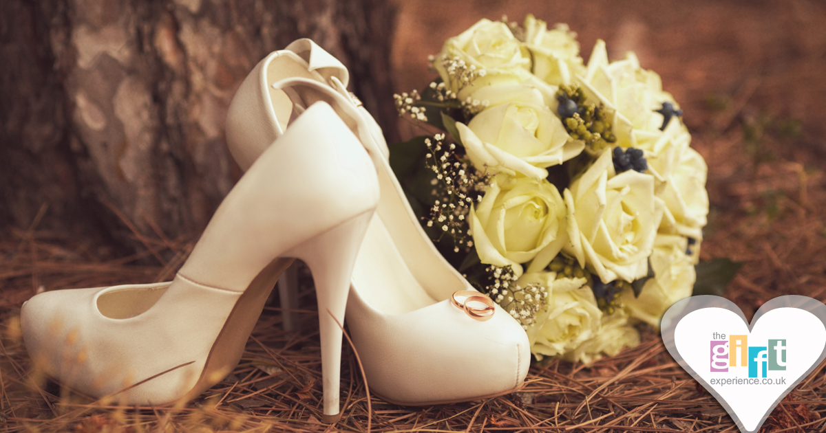 Ivory court shoes and a wedding bouquet in a wooded setting Ivory court shoes and a wedding bouquet in a wooded setting