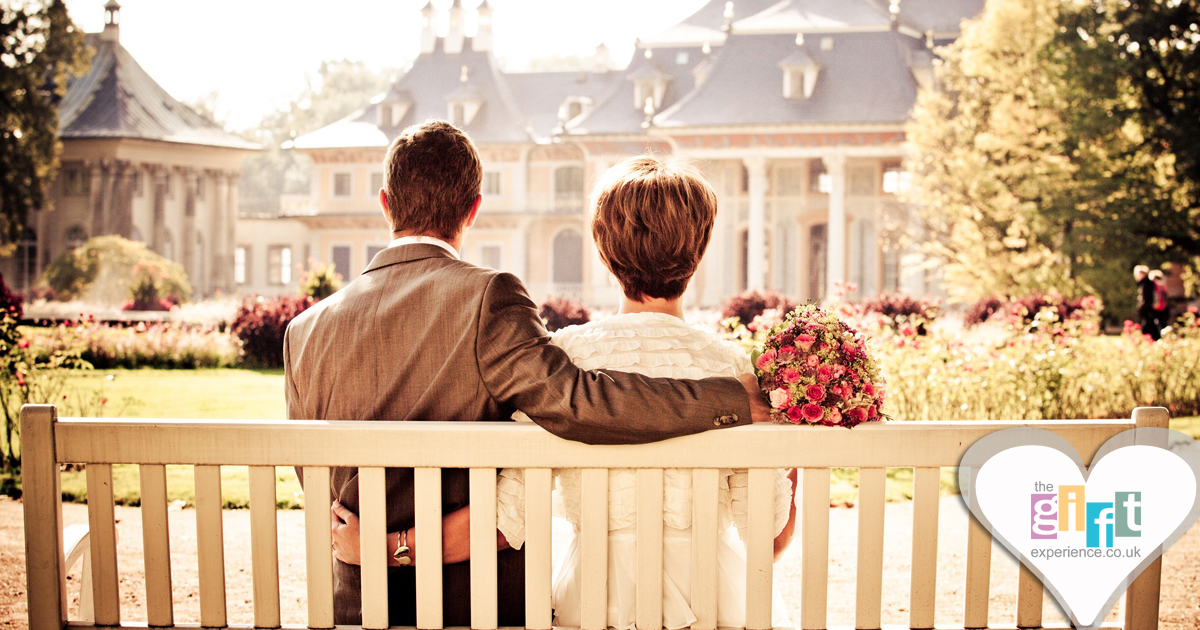 Groom and Mother of the Groom sitting on a bench